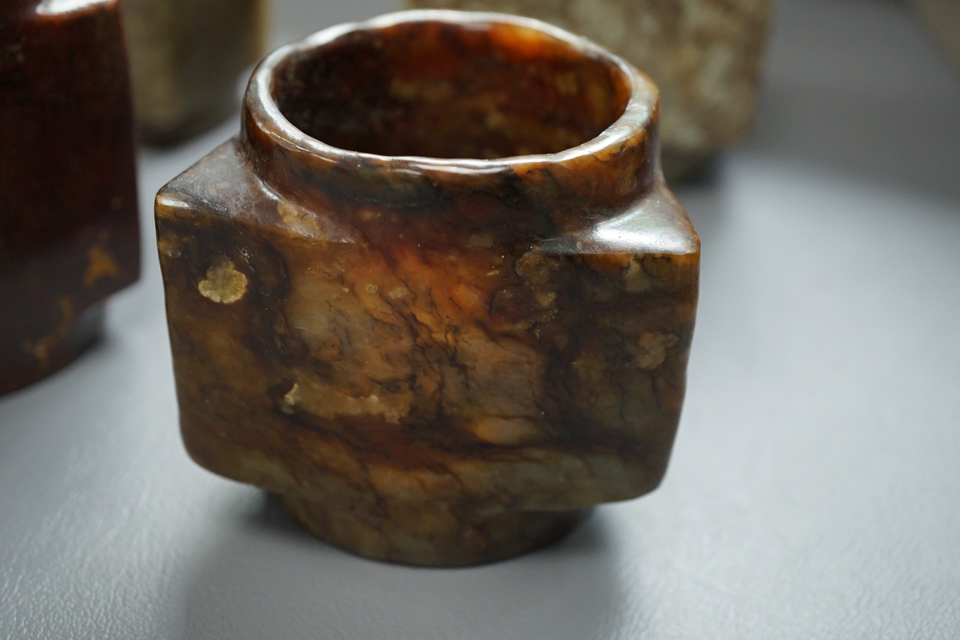 Four Chinese archaistic jade or hardstone cong